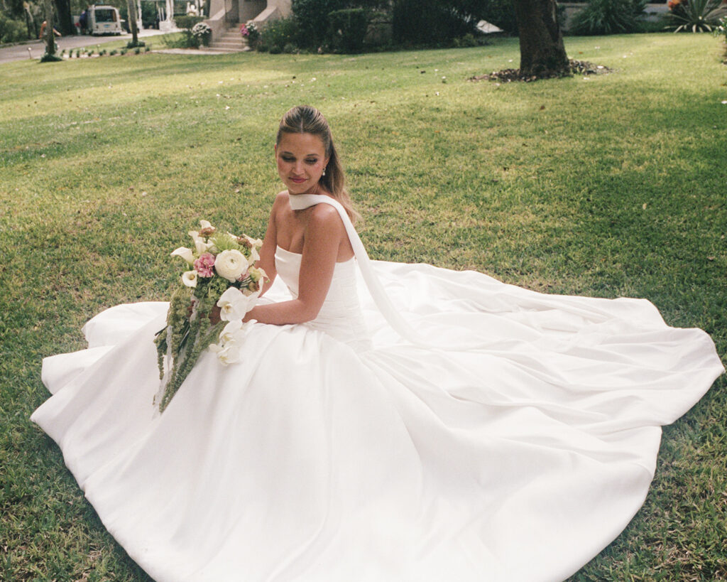bride sits in the field