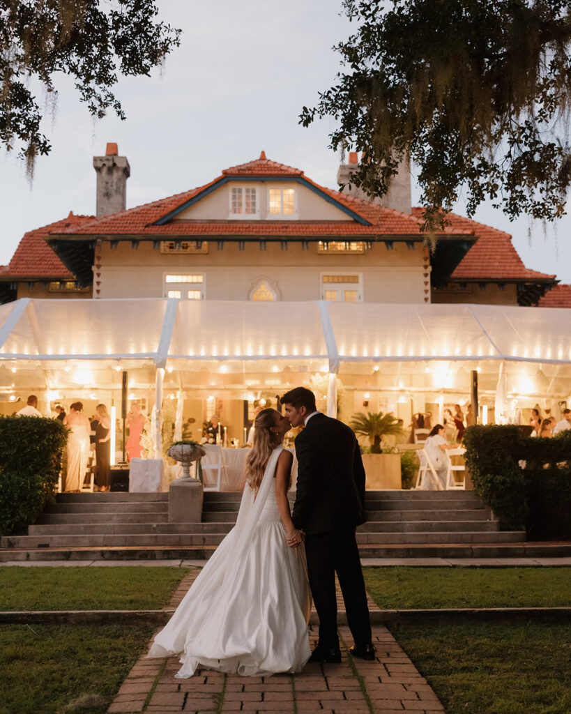 bride and groom kiss at Sydonie Mansion in Mount Dora, FL