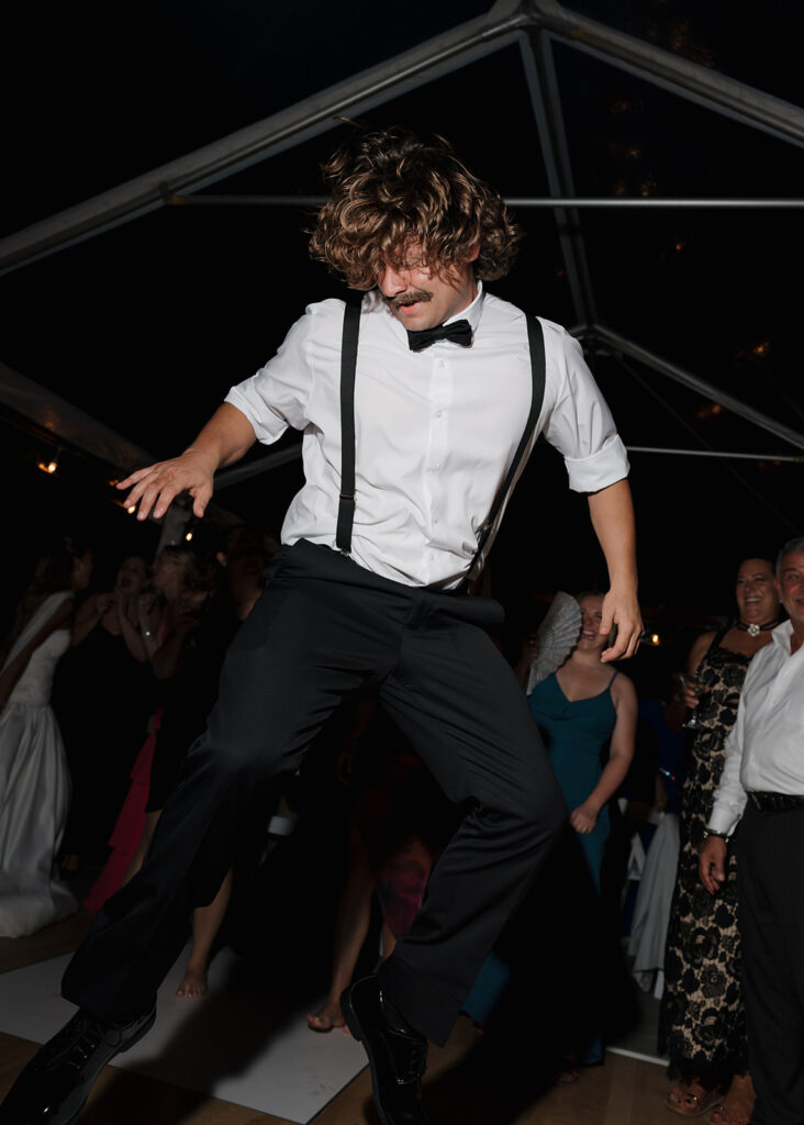 guests dance at the wedding reception