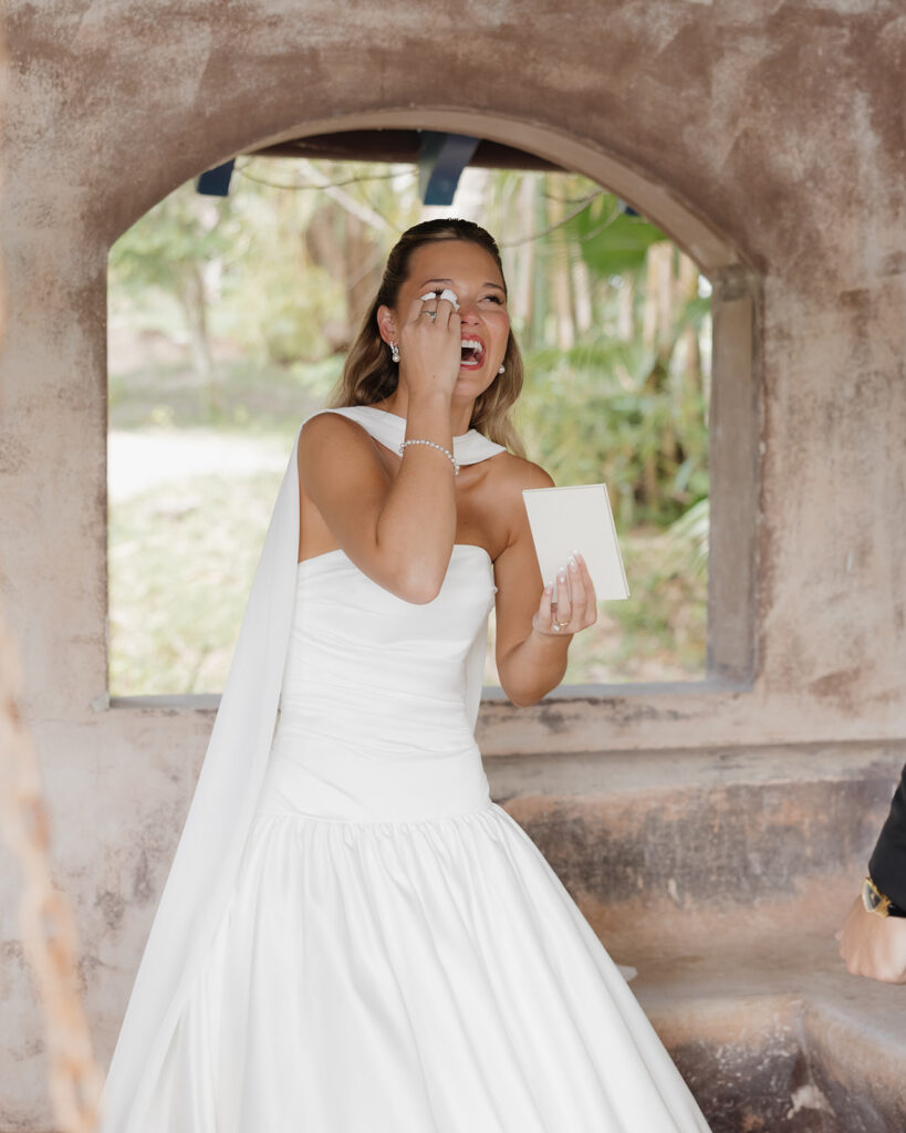 bride exchanges vows with her groom