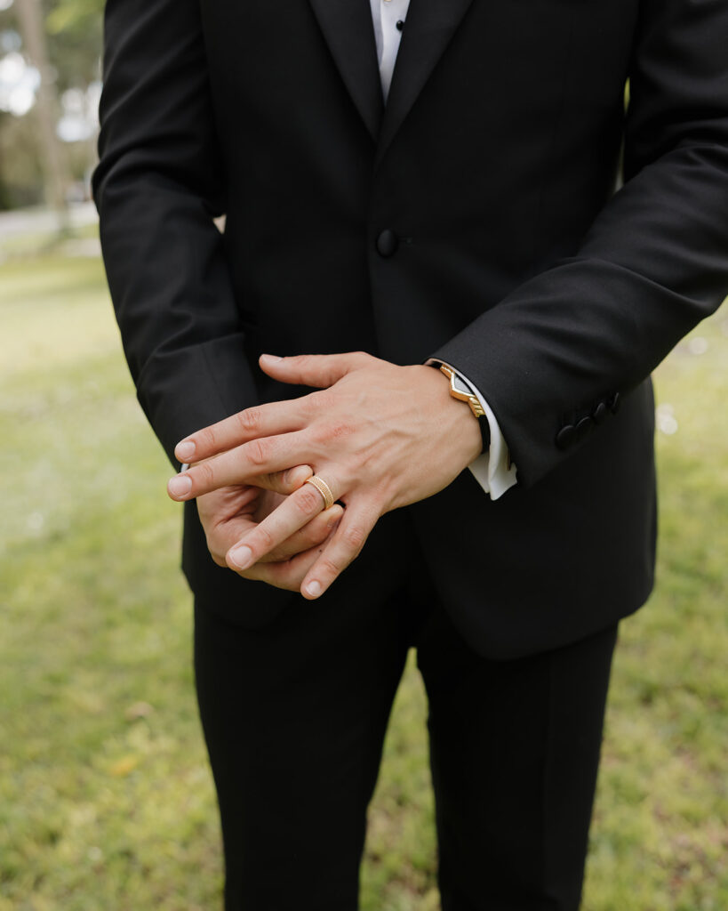 groom adjusts ring