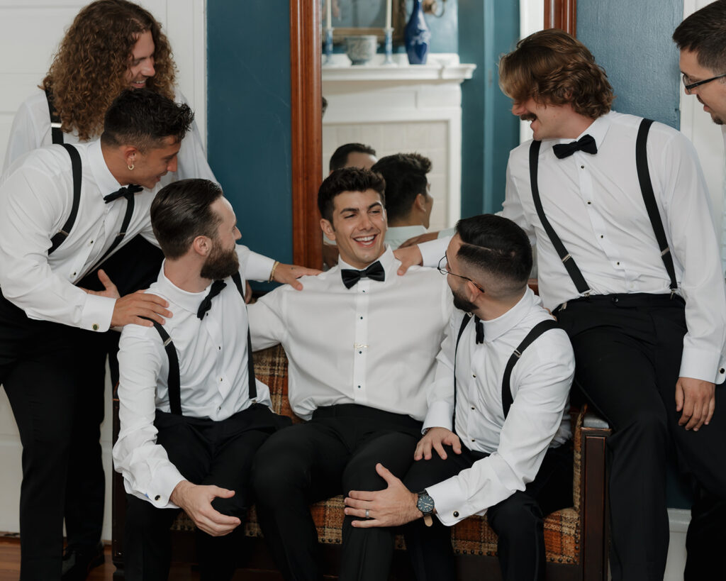 groom and groomsmen laugh