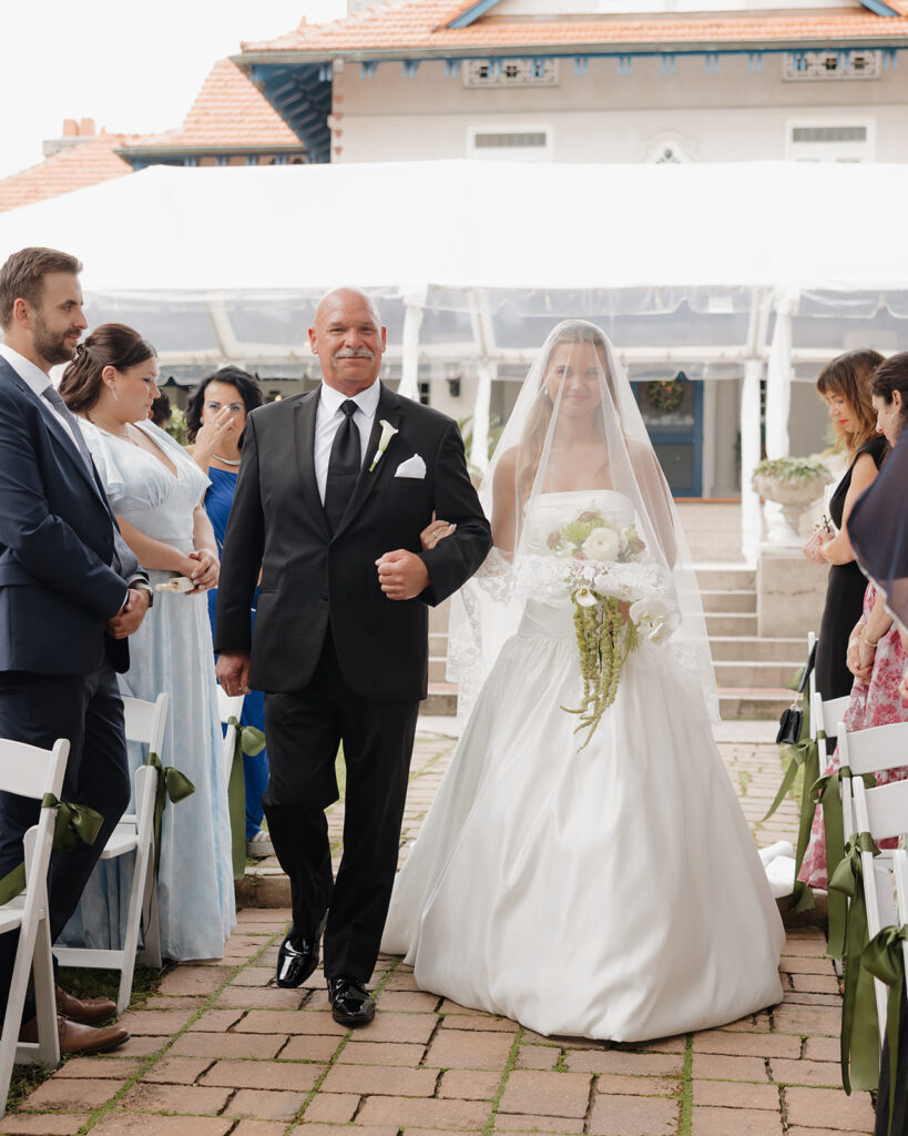 bride and father walk down the aisle