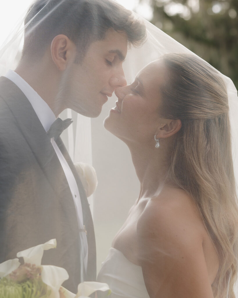 bride and groom kiss