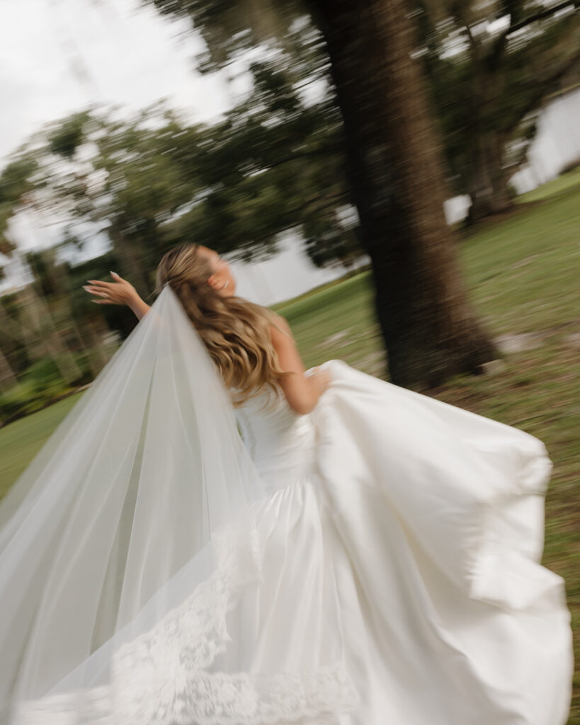 bride runs through the field of Sydonie Mansion