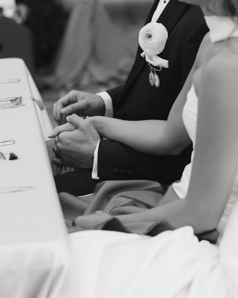 bride and groom hold hands at Sydonie Mansion